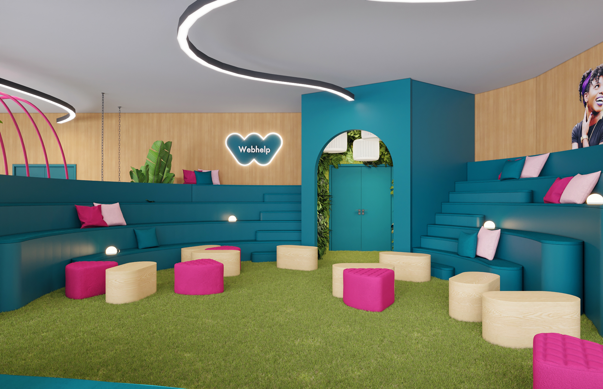 Decoração de um espaço de escritórios; zona lounge colorida com logo - Webhelp